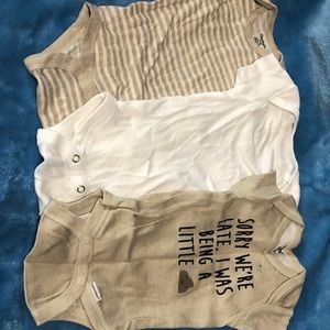 Three neutral onesies